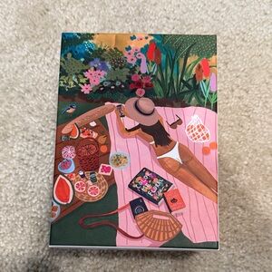 1000-Piece Jigsaw Puzzle - Sunbathers by surf shack